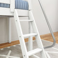 White wooden loft bed ladder with curved metal handrail and blue quilted mattress, modern bedroom hardwood floor and gray rug