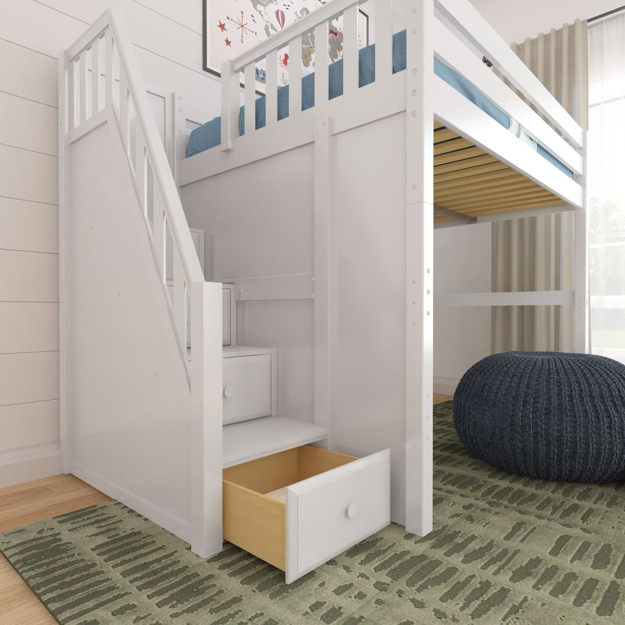 Space-saving white wooden loft bed with staircase and built-in storage drawers in a modern kids' bedroom with navy pouf and green rug