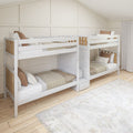 White wooden bunk beds with beige quilts and brown pillows in a neutral kids bedroom with paneled accent wall