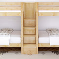 Light maple bunk bed with built-in ladder and storage drawers, twin mattresses with white bedding in a modern kids' bedroom