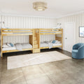 Natural twin bunk beds in a modern kids' bedroom with white shiplap walls, built-in stair drawers, neutral bedding, blue accent pillows and area rug