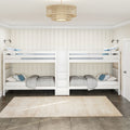 White twin bunk beds in a coastal modern farmhouse kids bedroom with shiplap walls, gray-blue bedding, wall-mounted reading lamps and woven rattan ceiling light
