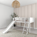 White kids loft bed with slide and ladder in a neutral farmhouse nursery, beige board-and-batten wall and rattan pendant light