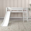 White kids loft bed with slide and ladder in neutral nursery — beige paneled wall, soft pillows, potted plant and patterned area rug
