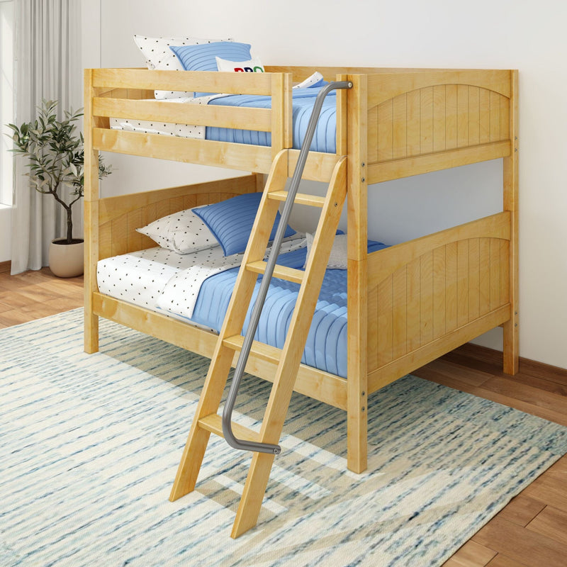 Light maple wooden twin-over-twin bunk bed with ladder, blue quilted bedding and star-print sheets in a modern kids' bedroom