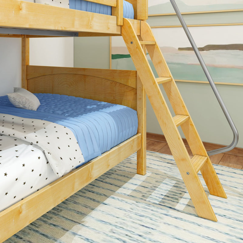 Pine wooden bunk bed with angled ladder, blue quilted bedding and star-pattern sheets in a modern kids bedroom