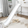 White kids loft bed with slide in a modern neutral children's bedroom featuring grey curtains, built-in shelves, potted plant and geometric rug