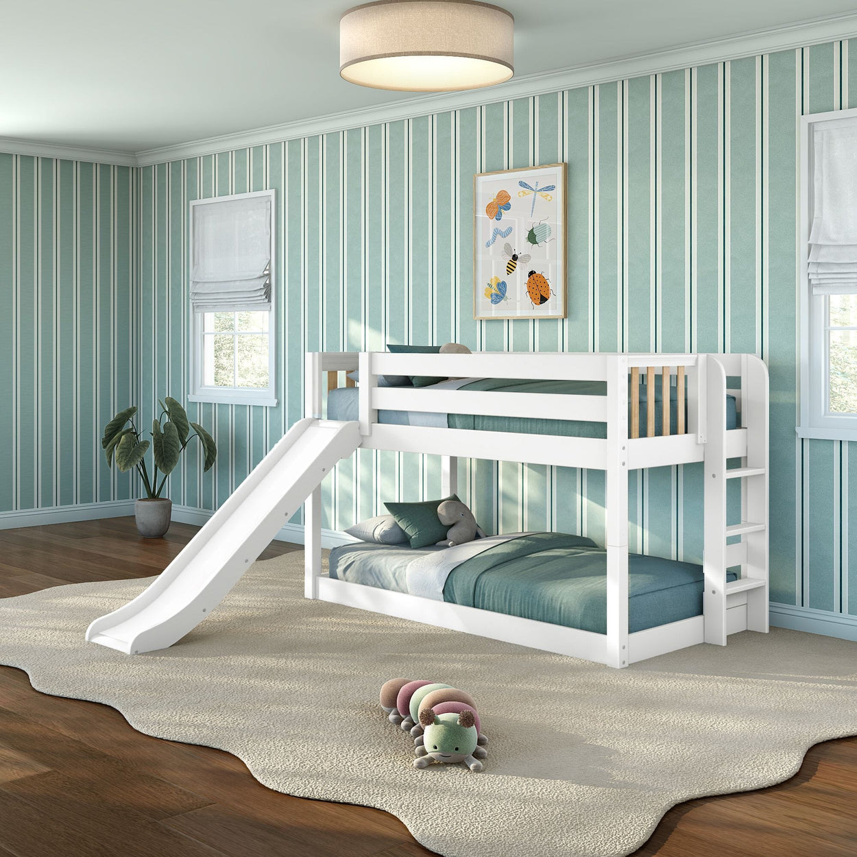 White twin-over-twin kids bunk bed with slide in modern children's bedroom with teal striped wallpaper, teal bedding, ladder, framed insect wall art, potted plant and plush caterpillar toy on a beige rug