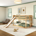 Natural wood kids bunk bed with slide, green bedding and wooden toy airplane in bright modern children's bedroom