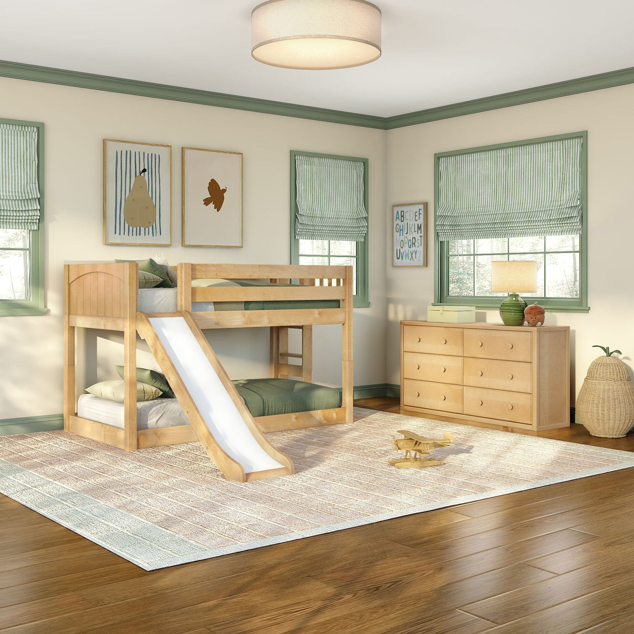 Natural wood bunk bed with slide in bright children's bedroom with green accents, wooden dresser, striped roman shades, area rug and wooden toy airplane