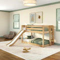 Natural wood kids bunk bed with slide in a modern green-themed bedroom, twin-over-twin bunk with green bedding, plush toys and wooden airplane on textured rug