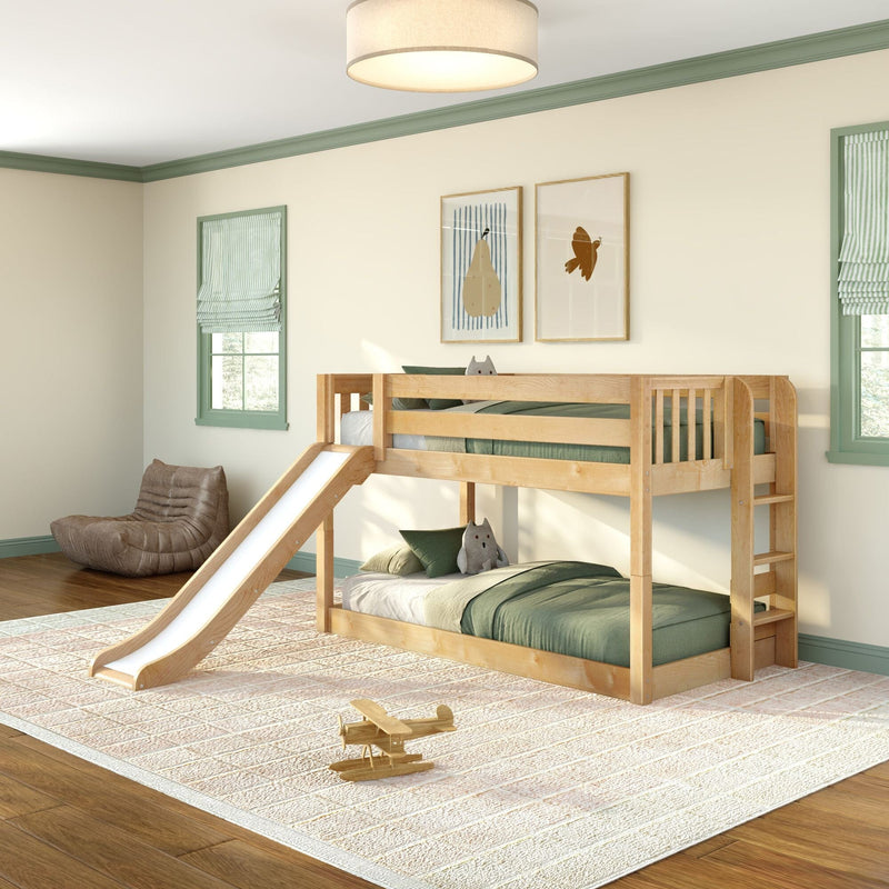 Natural wood kids bunk bed with slide in a modern green-themed bedroom, twin-over-twin bunk with green bedding, plush toys and wooden airplane on textured rug
