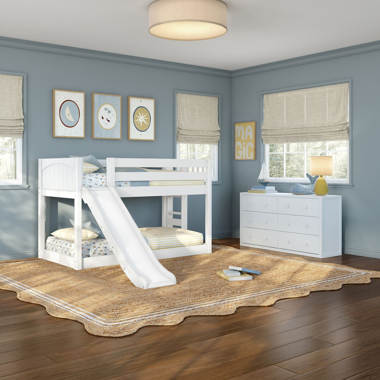 White kids bunk bed with slide in a light-blue children's bedroom with hardwood floors, woven rug, white dresser, lamp and nautical wall art