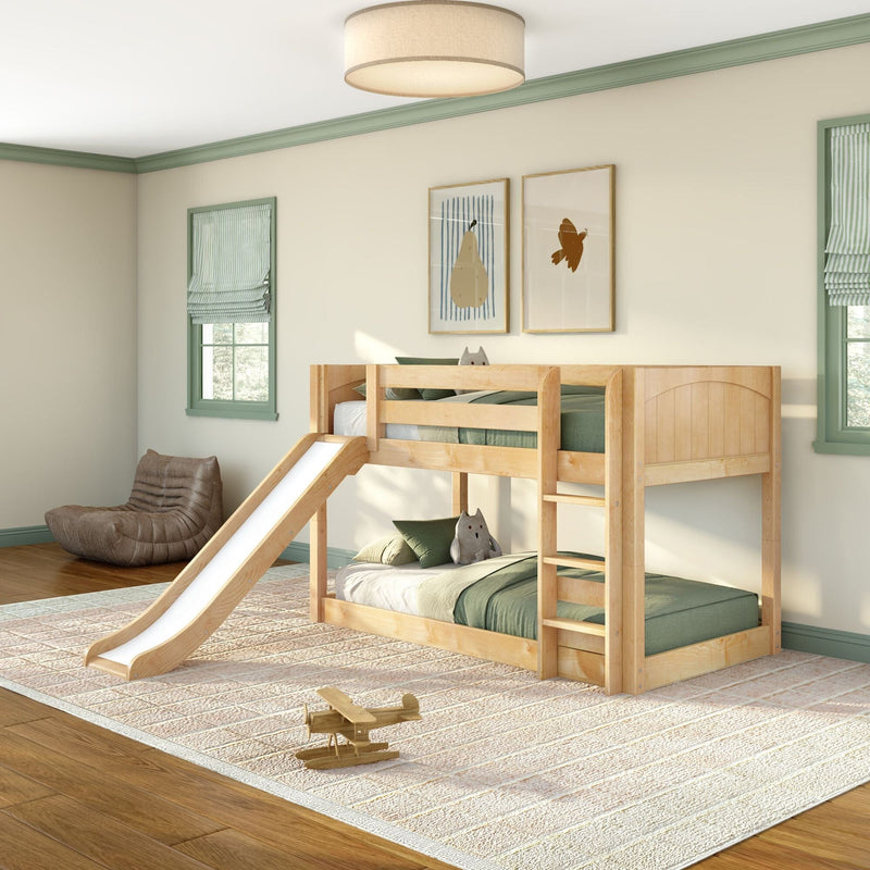Modern kids bedroom with natural wood bunk bed and slide, green bedding and trim, framed wall art and wooden toy airplane on rug.