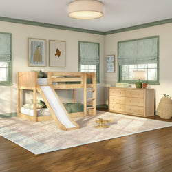 Kids bedroom with natural wood bunk bed and slide, green-trim windows, wooden dresser, woven rug and soft natural light
