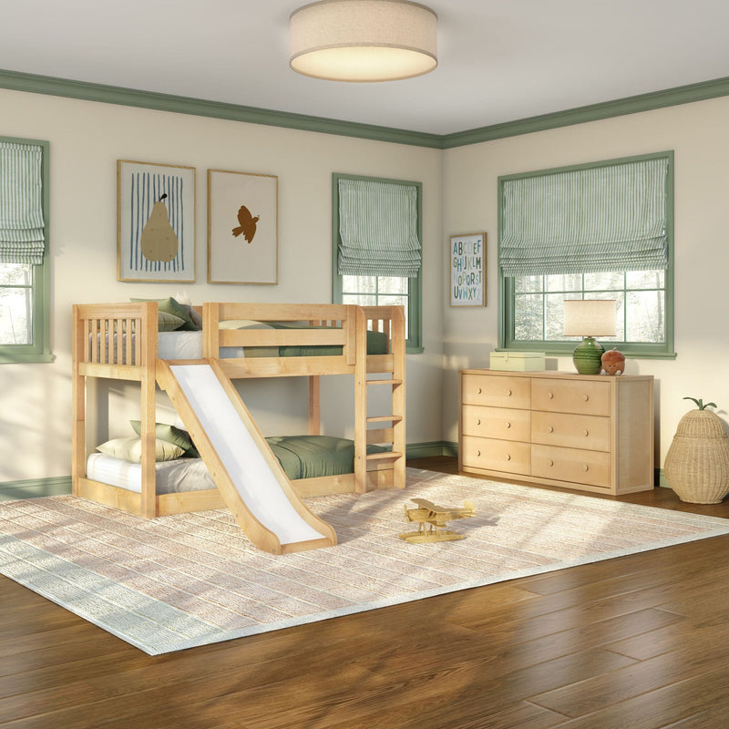 Children's bedroom with natural wood bunk bed and slide, green-trim windows with striped Roman shades, wooden dresser, plush toys and toy airplane on a neutral rug over hardwood floors, modern rustic kids' room decor