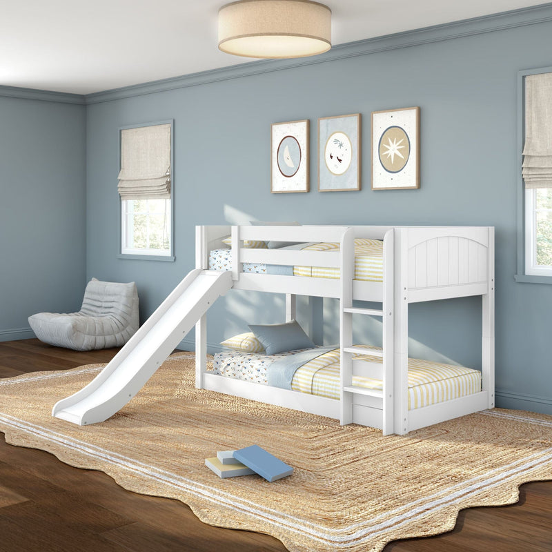 White wooden bunk bed with slide in light-blue kids' bedroom with striped bedding, framed wall art, beige woven rug and natural light