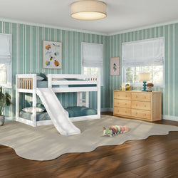 Sunlit kids' bedroom featuring a white bunk bed with slide, teal striped wallpaper, light wood dresser, and plush caterpillar toy