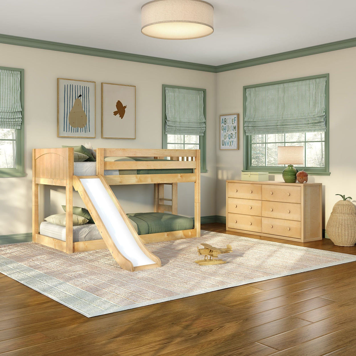 Bright kids' bedroom with natural wood bunk bed and slide, green bedding and window trim, matching dresser, toy airplane, and hardwood floors.