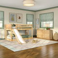 Kids bedroom with natural wood loft bunk bed and slide, green-trim windows with striped Roman shades, wooden dresser and cozy decor