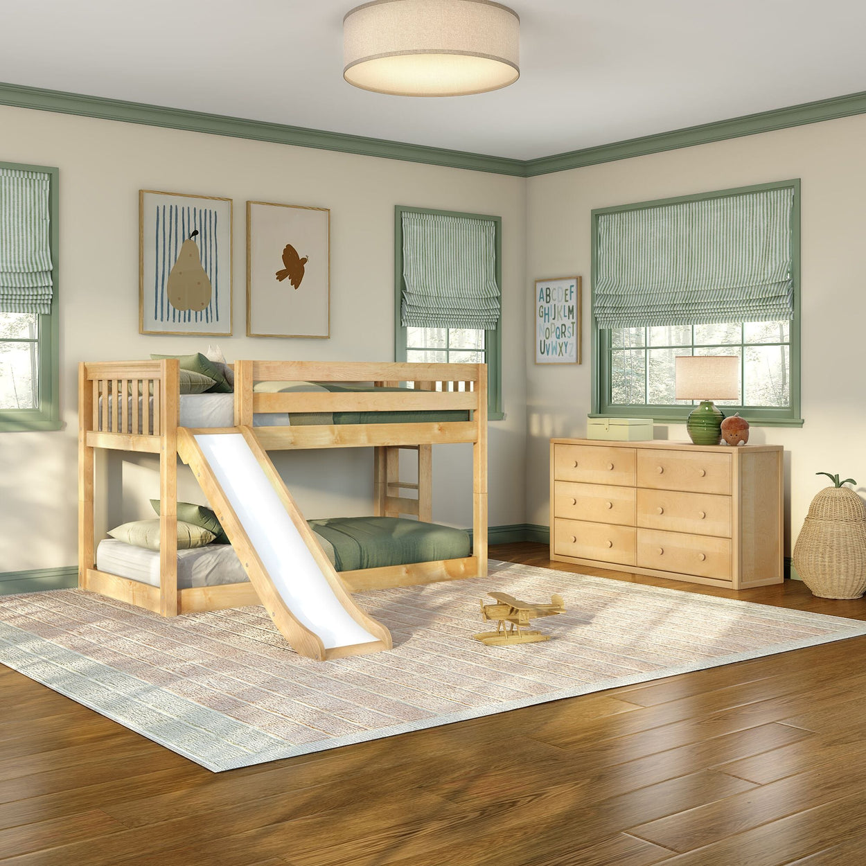 Children's bedroom with natural wood bunk bed and slide, green-trimmed windows, dresser, striped roman shades, rug and toy airplane