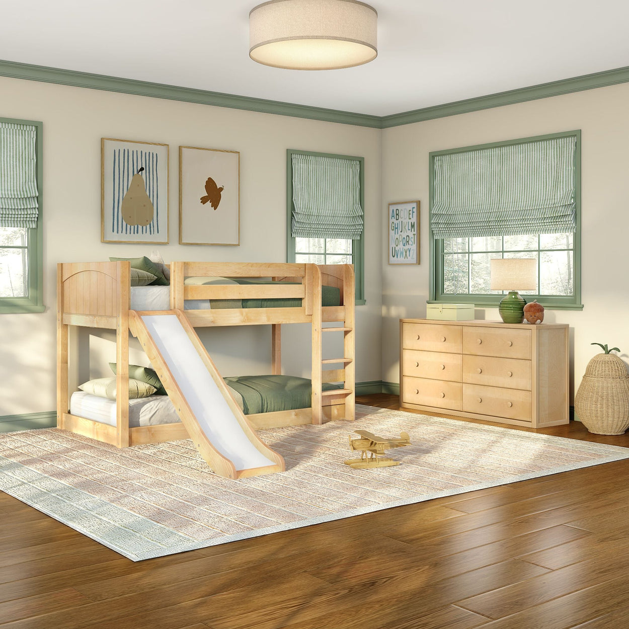 Bright kids bedroom with light wood bunk bed and slide, green-trimmed windows with striped Roman shades, matching light-wood dresser, woven area rug and wooden toy airplane, modern children's room decor