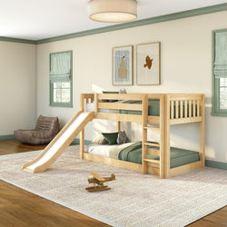 Solid natural wood twin-over-twin bunk bed with slide in bright children's bedroom, green bedding, hardwood floors, area rug, toy airplane and cozy bean bag, modern kids furniture and playroom design