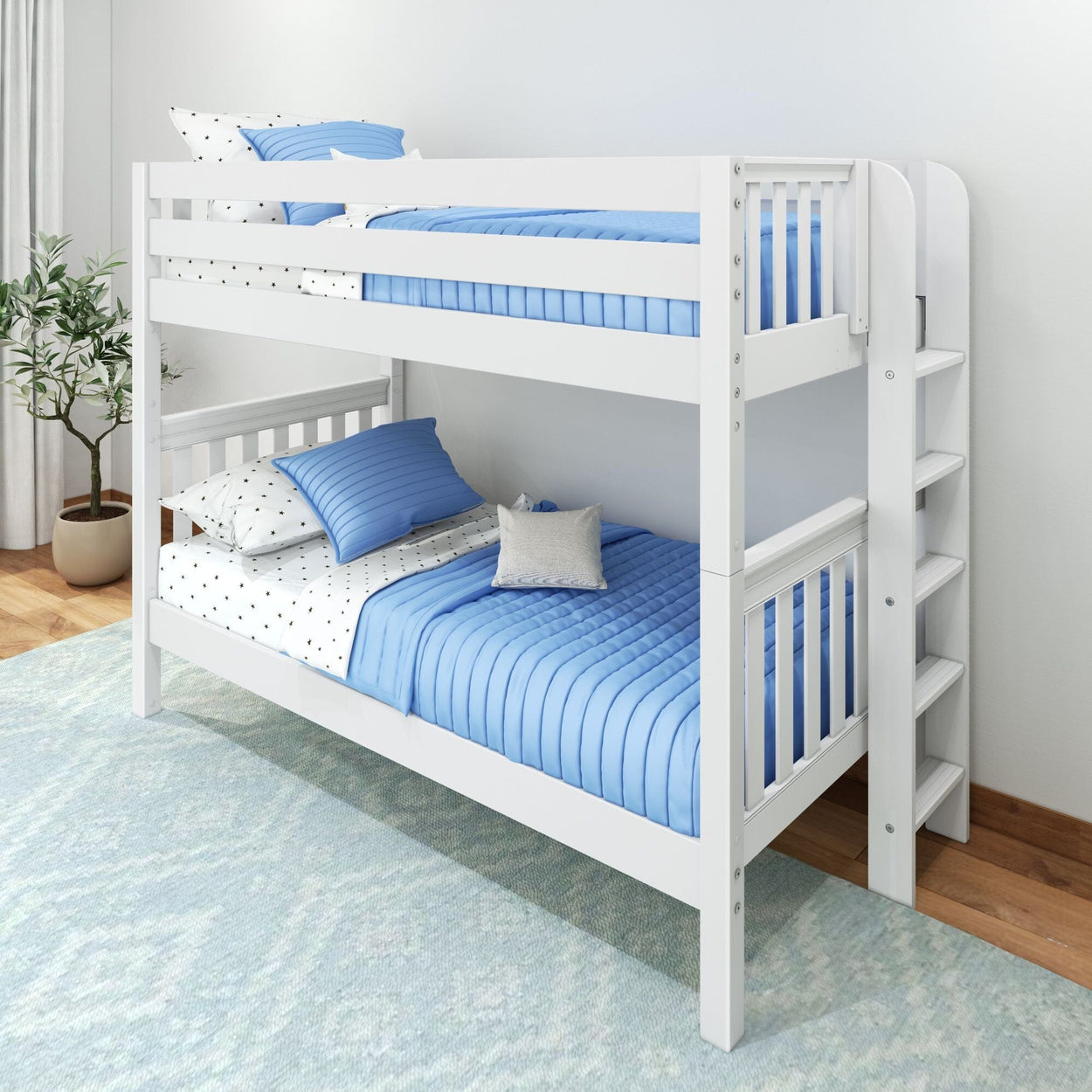 White wooden twin-over-twin bunk bed with blue quilted bedding, safety rails and built-in ladder in a bright kids' bedroom
