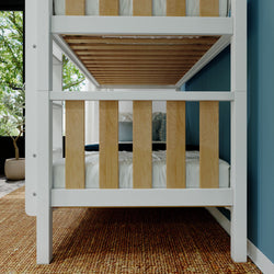 Stylish wooden bunk bed with white and natural wood finish in modern kid's bedroom.