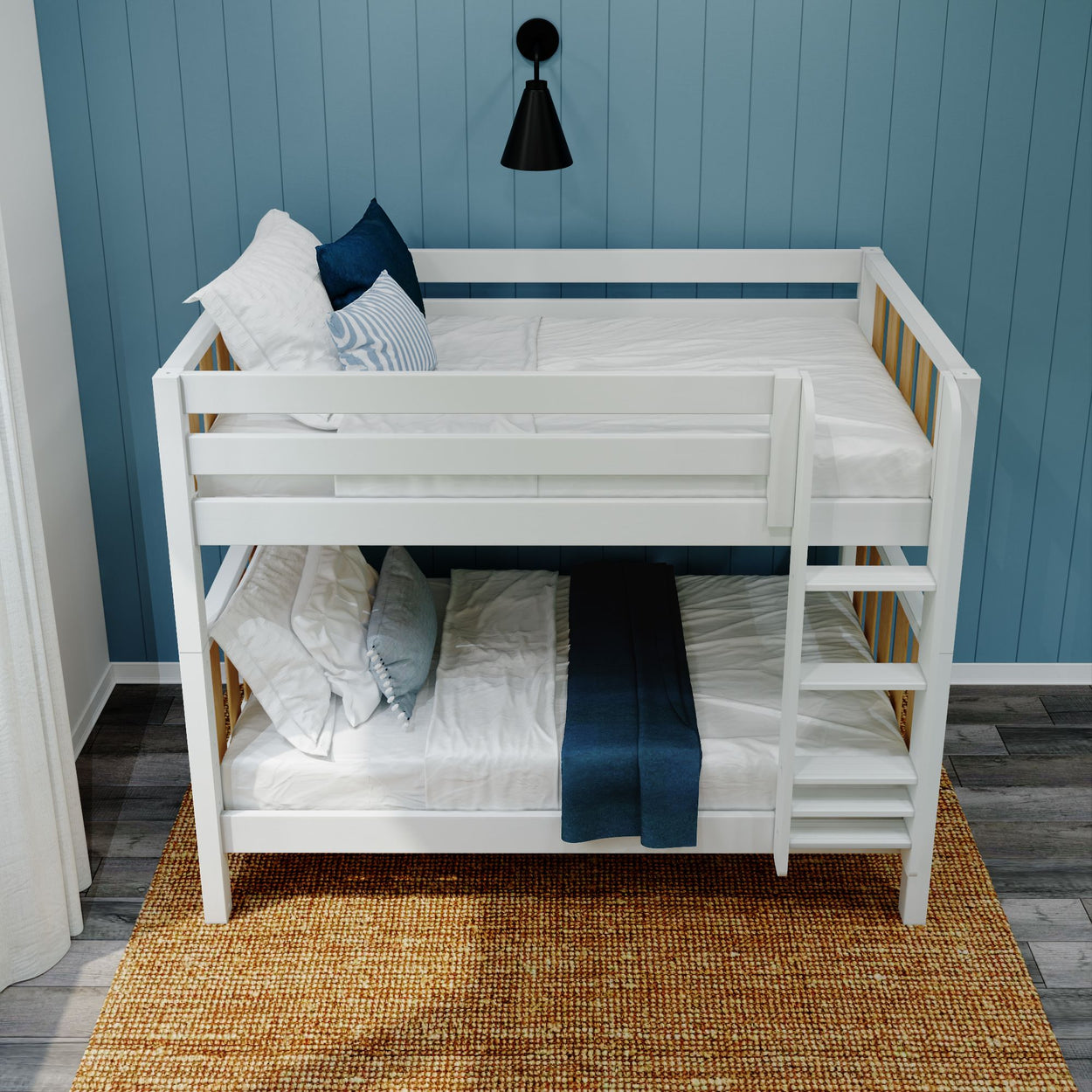 White wooden bunk bed with blue pillows in a modern bedroom setup.