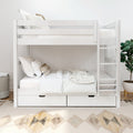 White wooden bunk bed with built-in storage drawers and ladder, neutral linens and boho accent pillows in a modern kids bedroom with potted plant and patterned rug