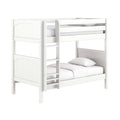 White wooden space-saving bunk bed with integrated ladder, safety guardrails and white bedding — modern kids' loft bed for small bedrooms