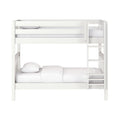 White wooden twin-over-full bunk bed with ladder and guardrails, white bedding and pillows, modern space-saving design