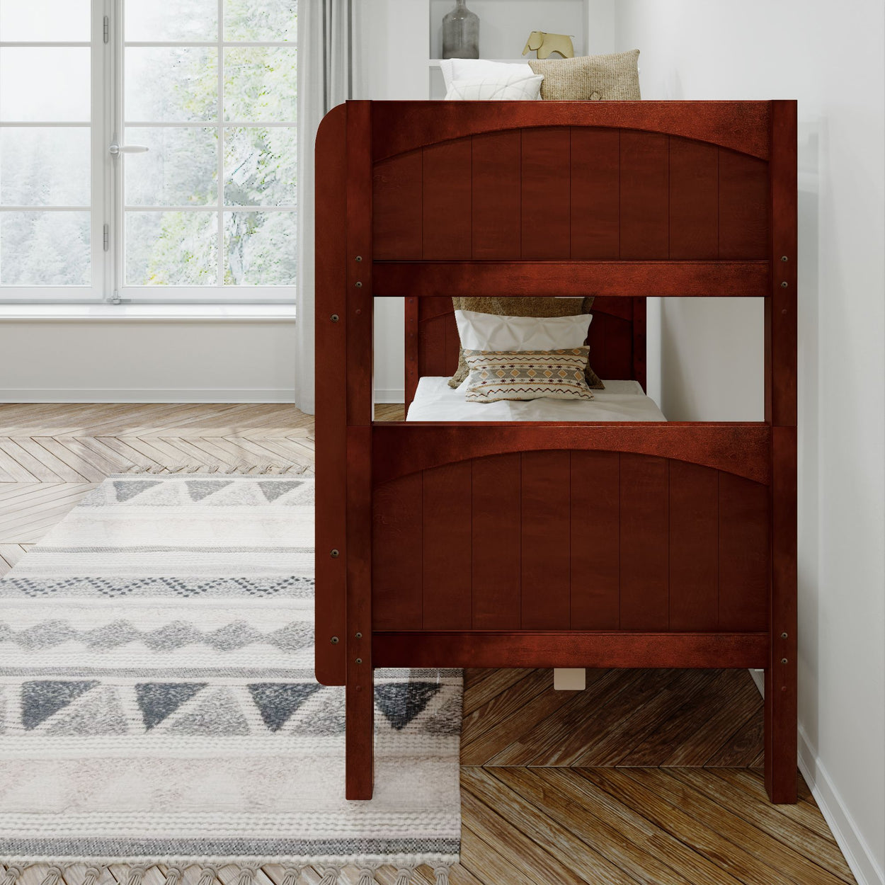 Wooden bunk bed in modern bedroom with large window and patterned rug.