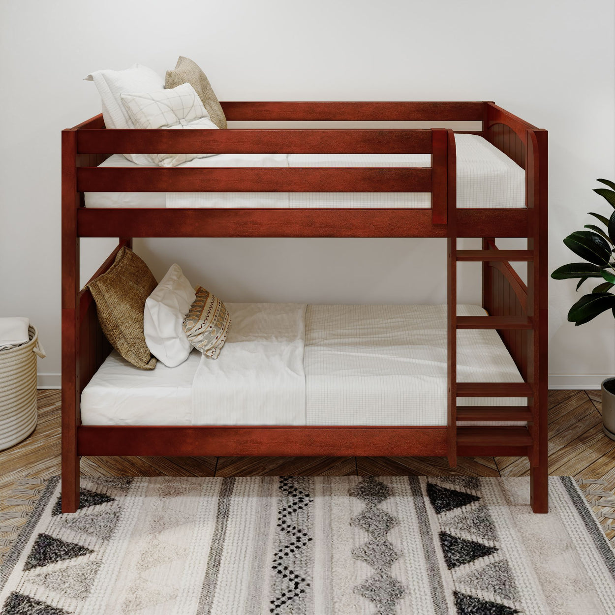 Wooden bunk bed with white bedding and decorative pillows in a cozy, minimalistic bedroom setting.