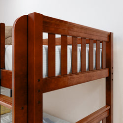 Wooden bunk bed with comfortable mattress in a minimalist bedroom setting.