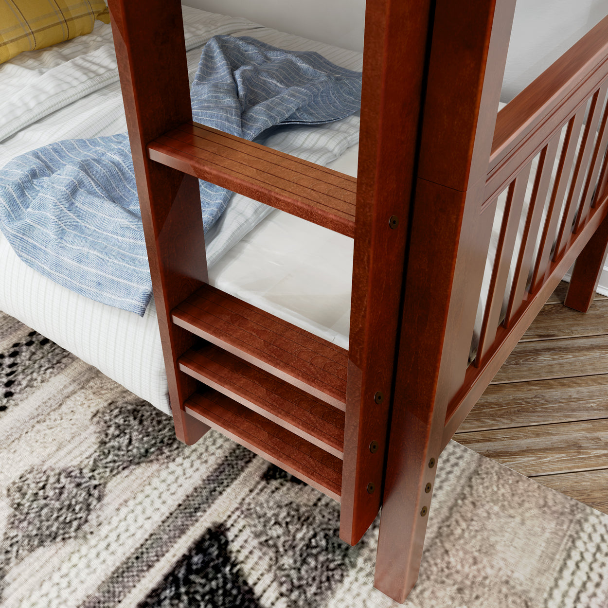 Wooden bunk bed ladder and bedding with blue and yellow blankets in a cozy bedroom setting.