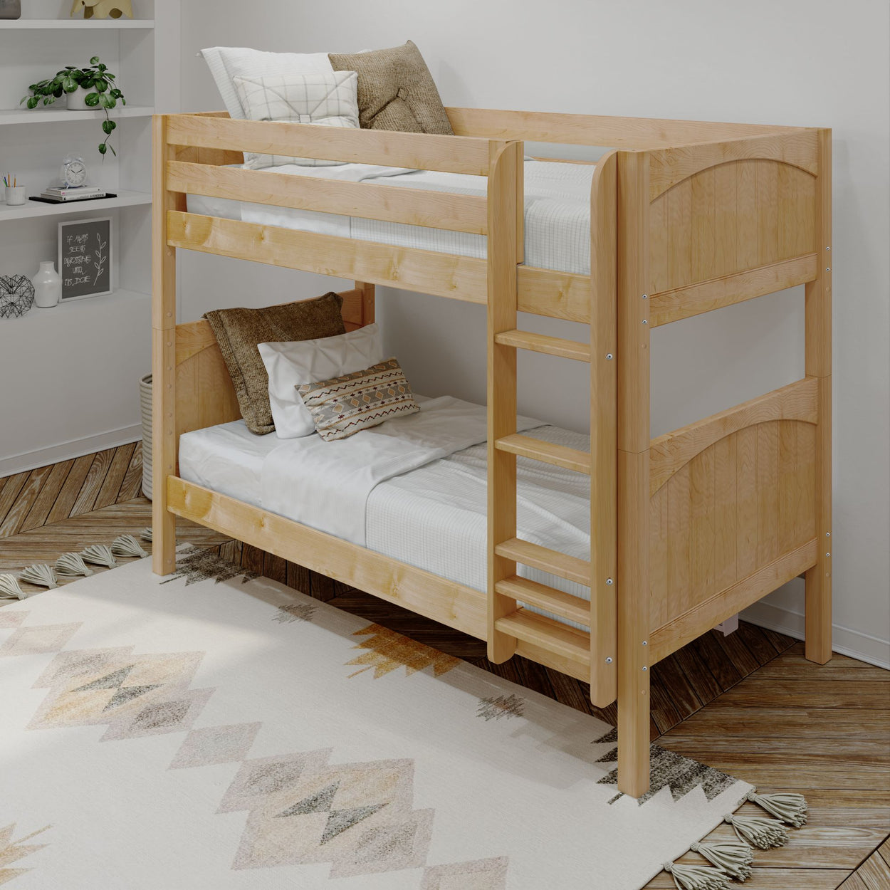 Wooden bunk bed with white bedding in a cozy, modern bedroom featuring a decorative rug and cozy pillows.