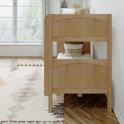 Wooden bunk bed in bright, modern bedroom with rug and window view.