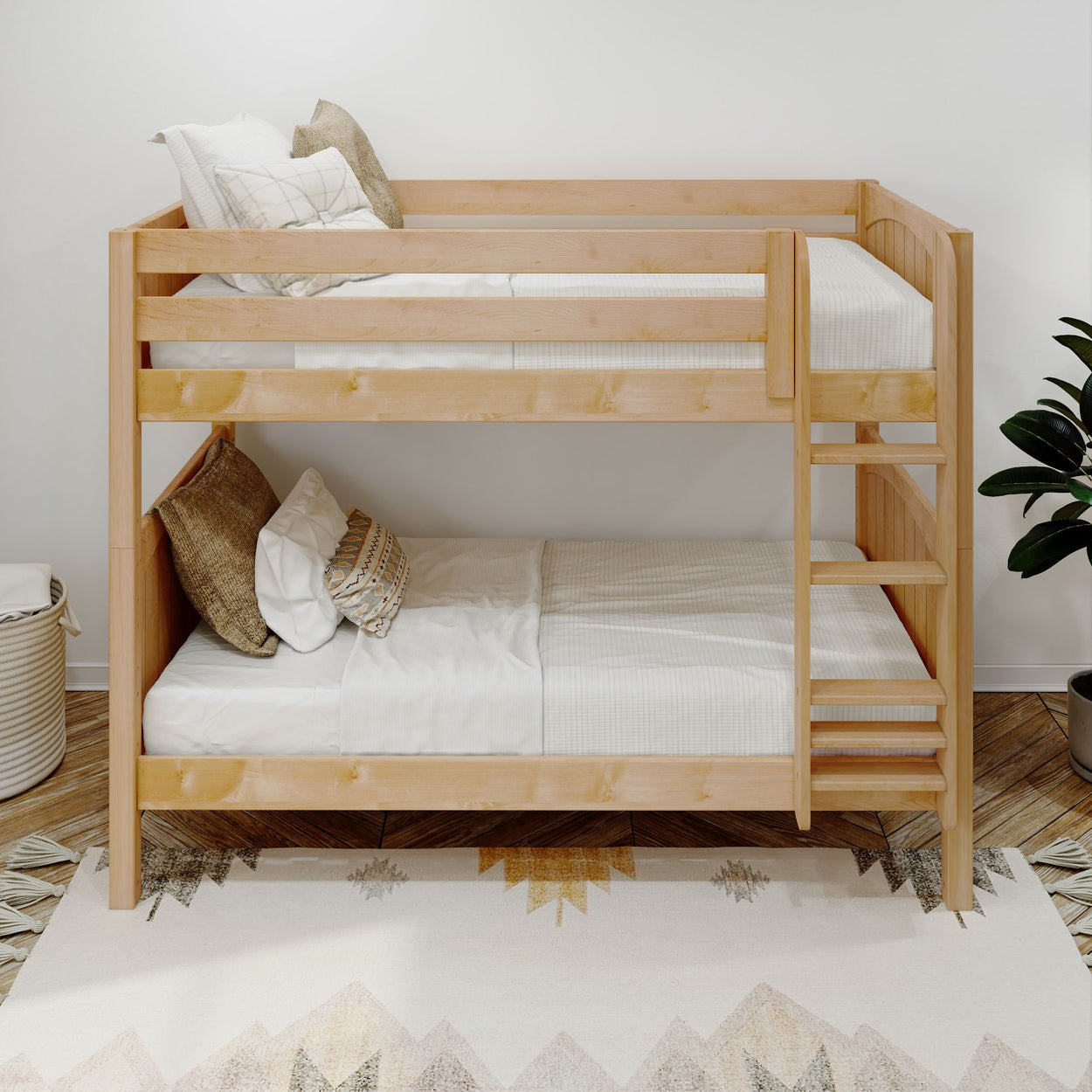 Wooden bunk bed with white bedding and decorative pillows in a cozy bedroom.