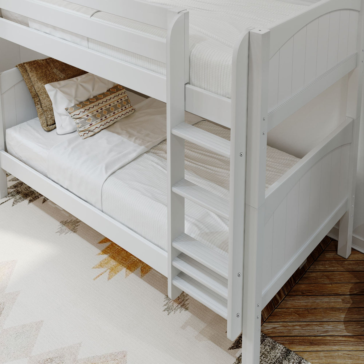 White wooden bunk bed with decorative pillows in a cozy bedroom setting.