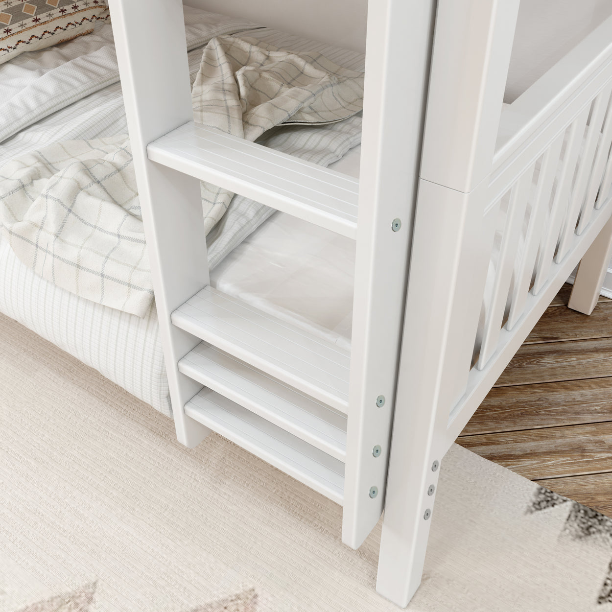 White bunk bed ladder with cozy plaid bedding, on wooden floor.