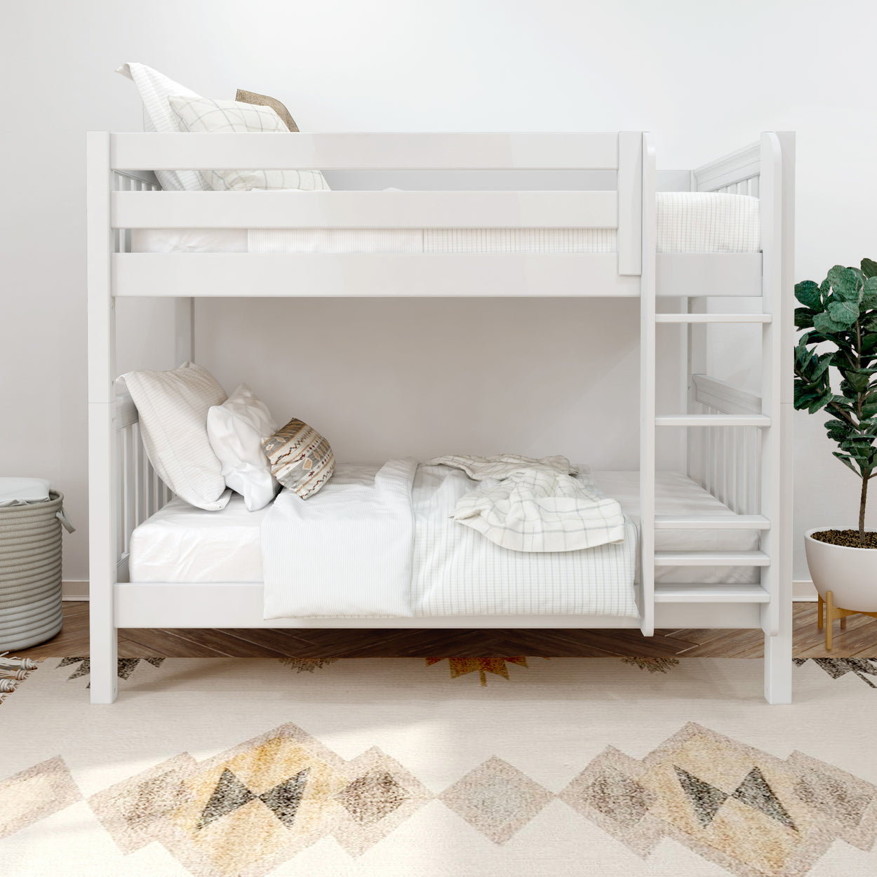 White wooden bunk bed in modern, minimalist bedroom with cozy bedding and decorative pillows.