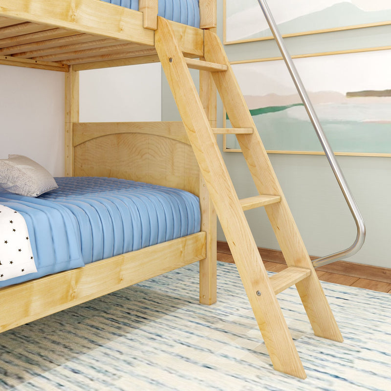Light wood bunk bed with angled ladder and blue quilted bedding in modern coastal kids' bedroom with framed wall art