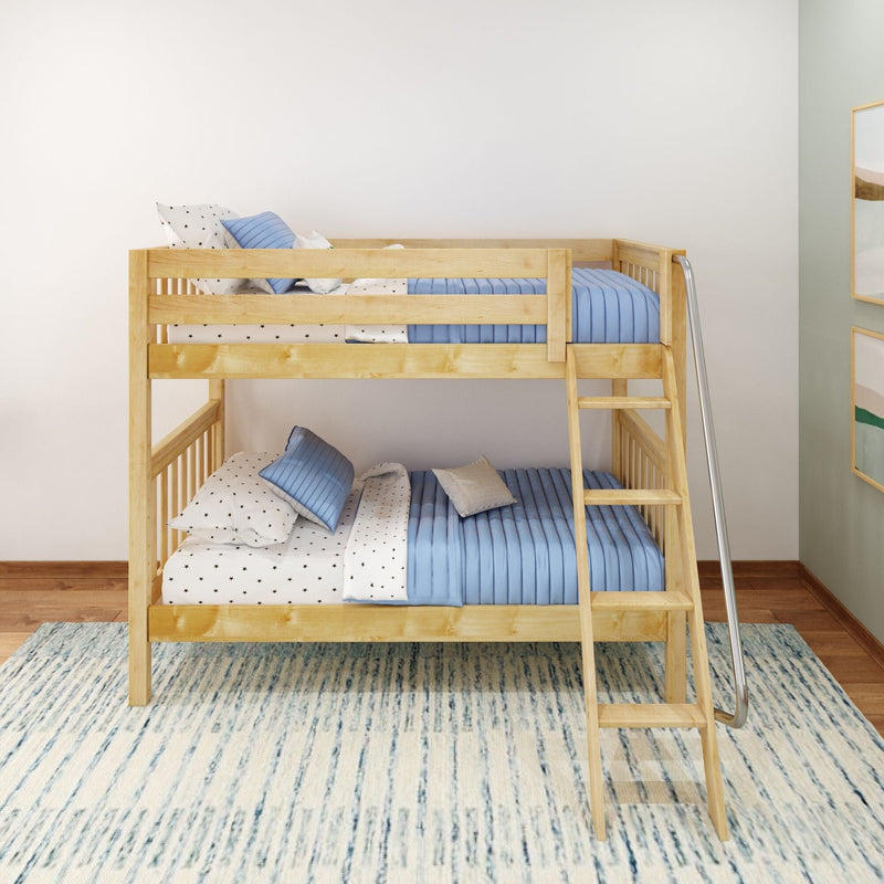 Natural wood twin-over-twin bunk bed in a children's room with blue quilted bedding, star-print sheets, safety rails, ladder and metal slide on hardwood floors and a patterned rug