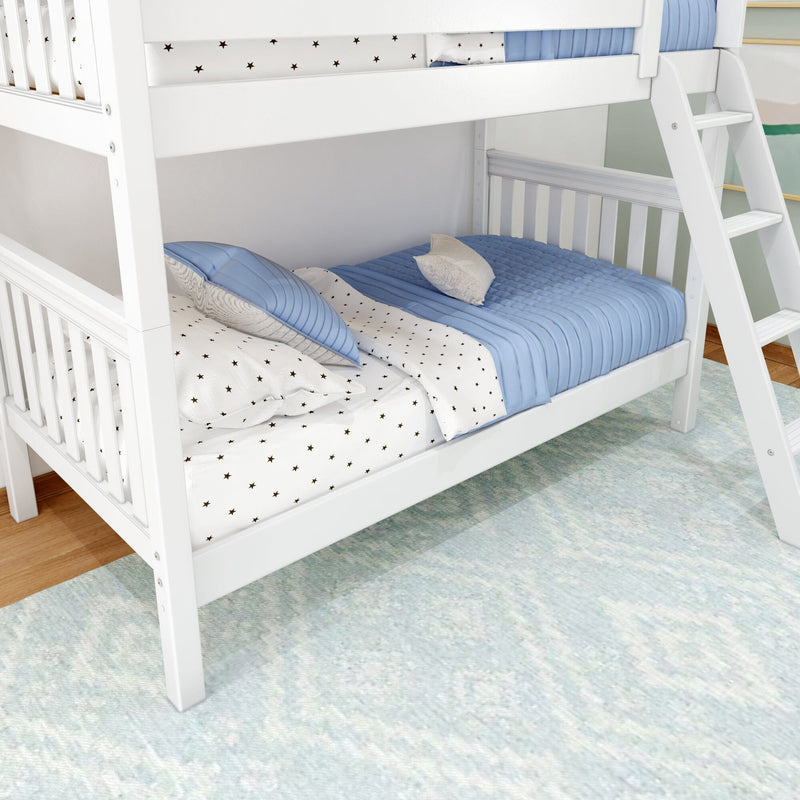 White wooden twin-over-twin bunk bed with ladder, blue quilted bedding and star-print sheets in a modern kids' bedroom