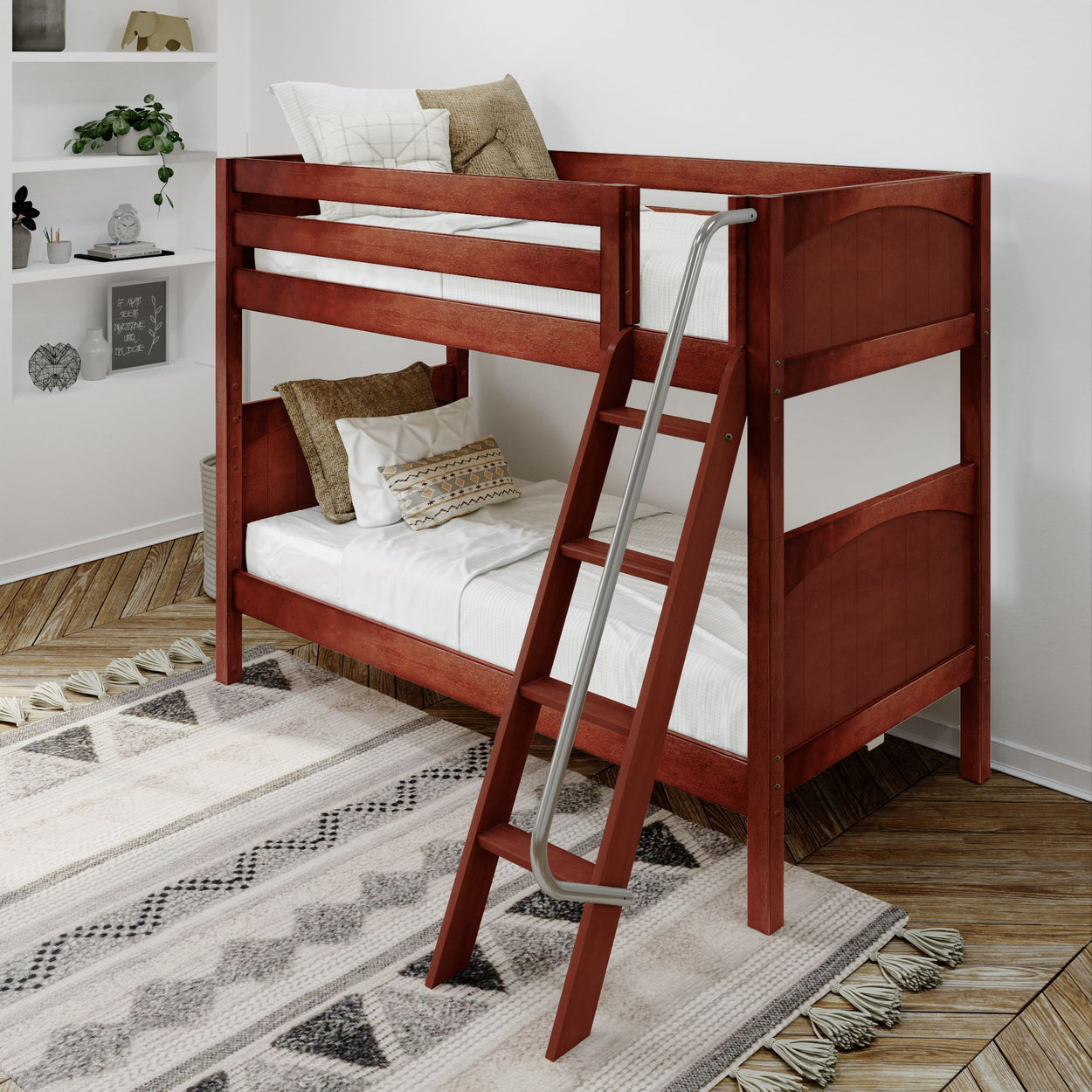 Wooden bunk bed with ladder in a cozy bedroom featuring patterned bedding and a textured rug.