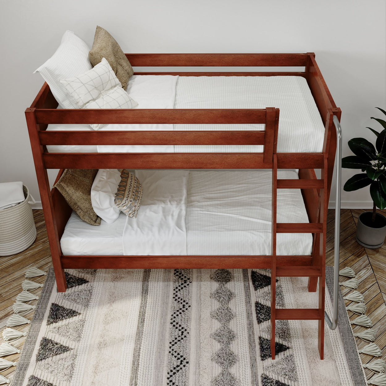 Wooden bunk bed with white bedding and cozy pillows in a modern bedroom setting featuring a patterned rug, ideal for maximizing space in small rooms.
