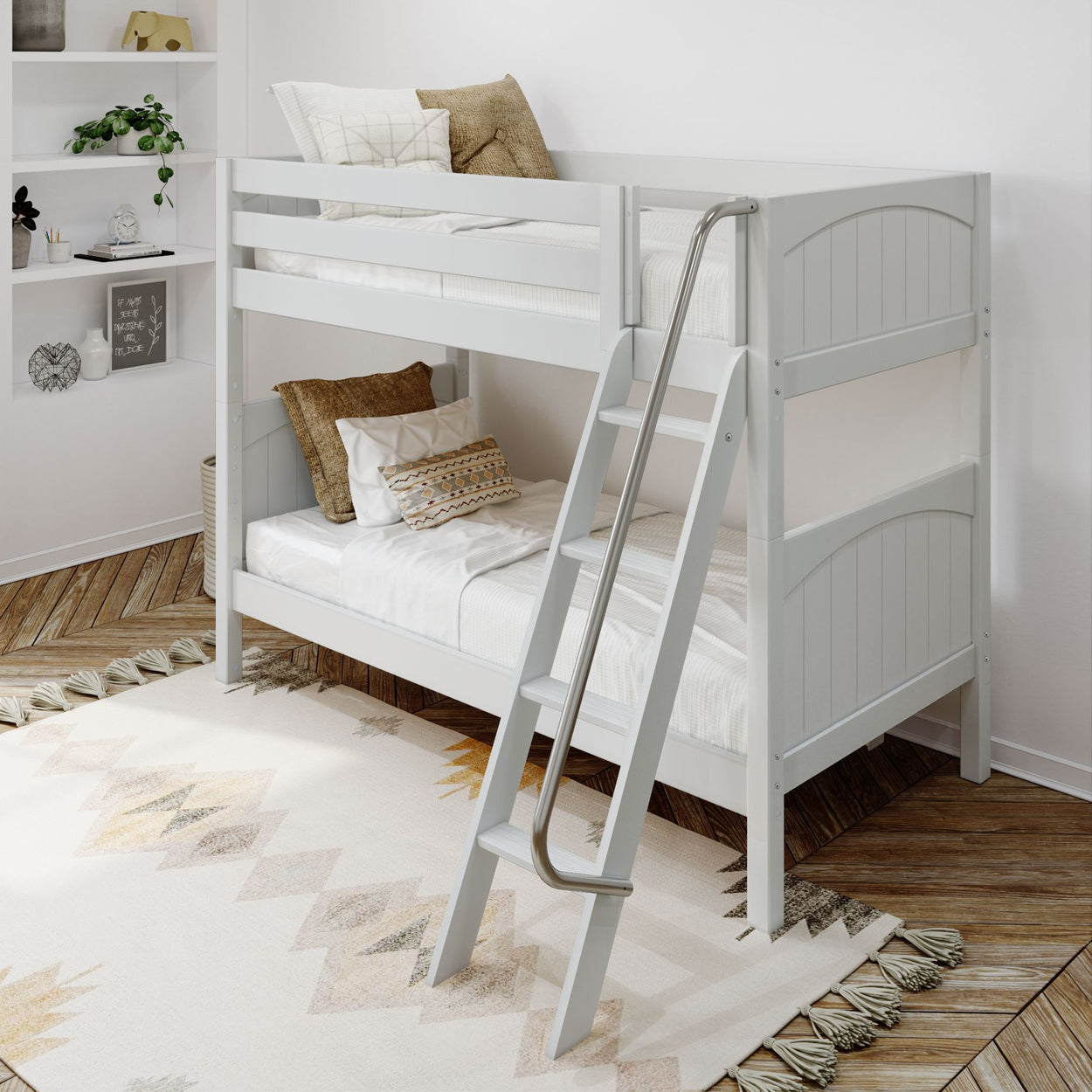 White wooden bunk bed with cozy pillows in a modern kids' bedroom.