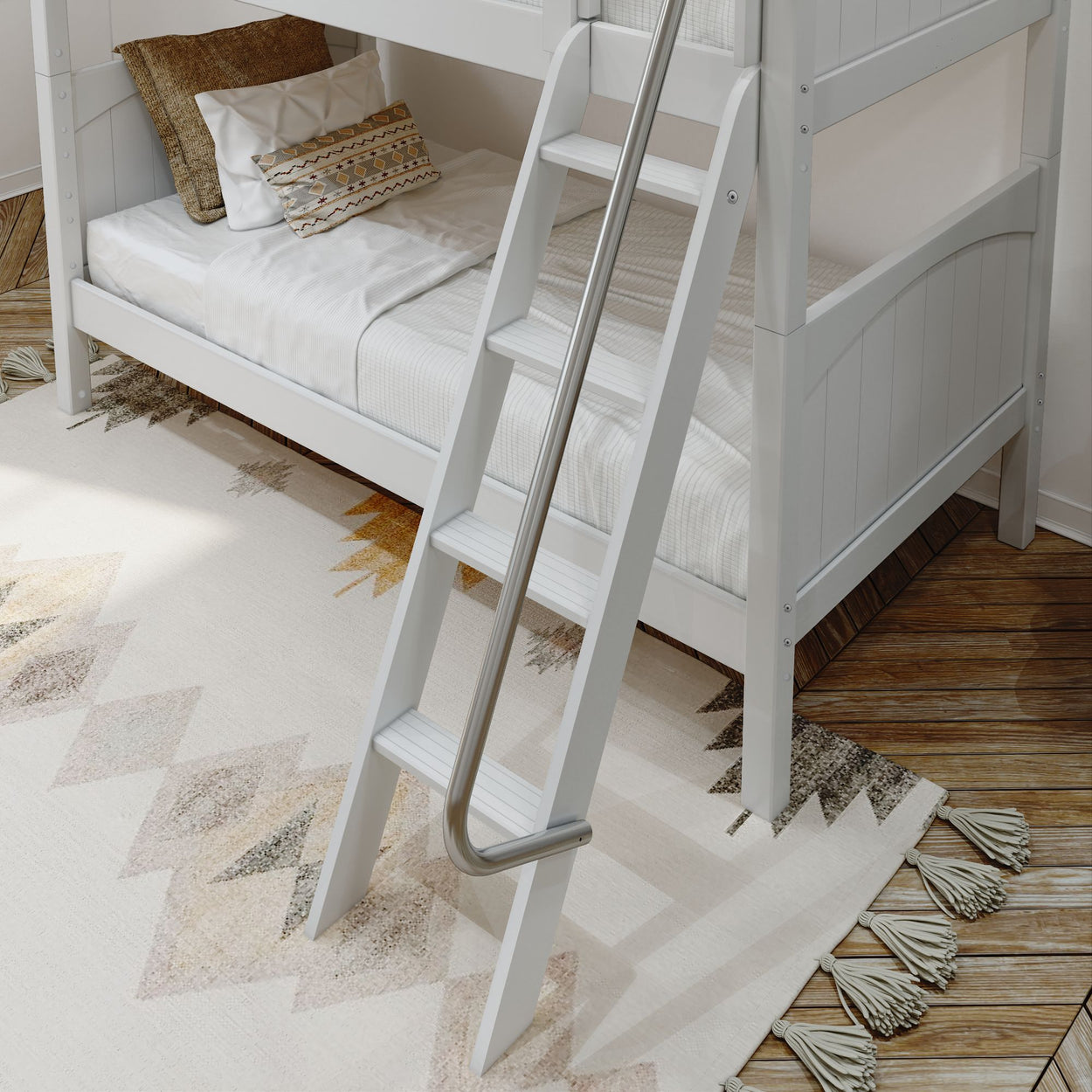 White wooden bunk bed with ladder and patterned rug on hardwood floor.